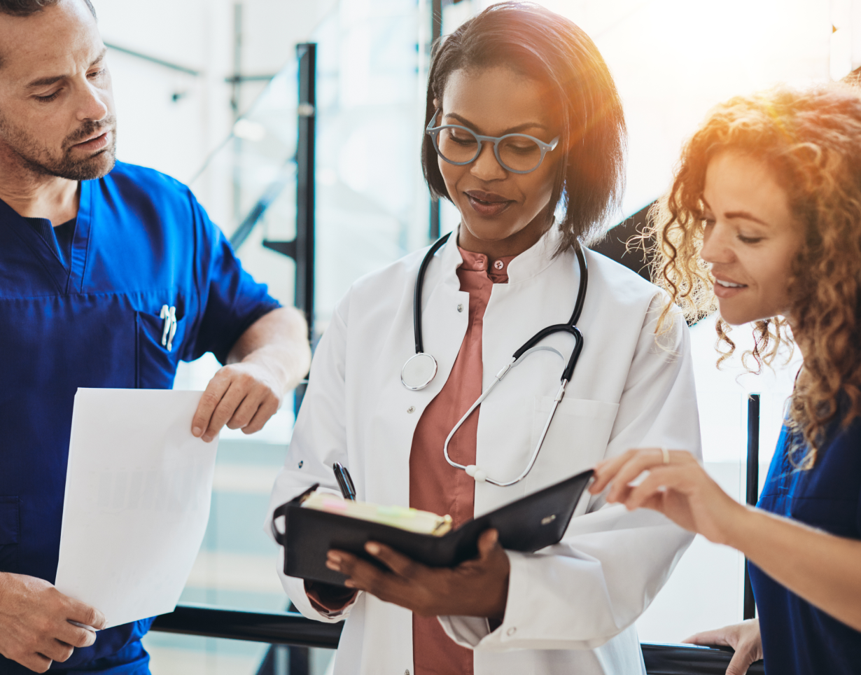 A doctor and group of care navigators talking about a patient.