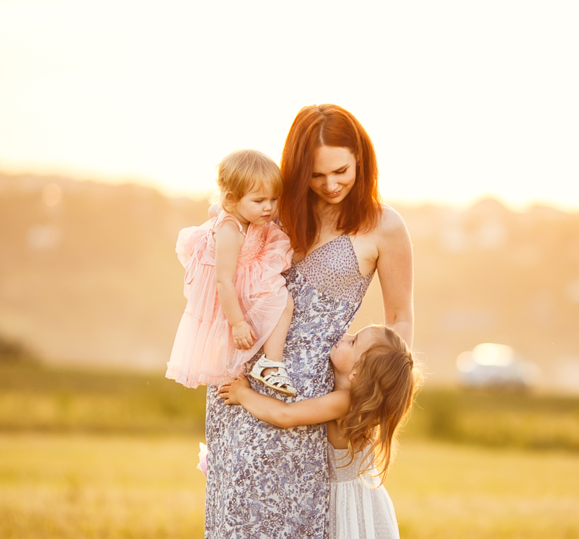 Mother with two kids in a field